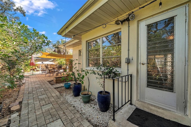 doorway to property with a patio area