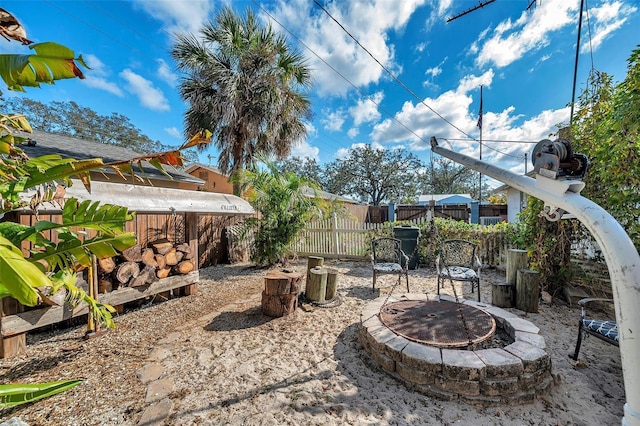 view of patio with an outdoor fire pit