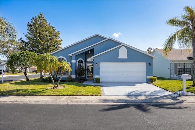 single story home featuring a garage and a front yard