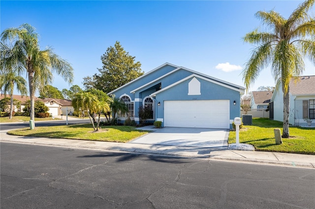 ranch-style home with a garage, a front yard, and central air condition unit