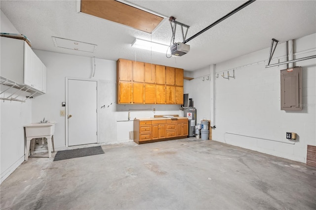 garage featuring sink, a garage door opener, electric panel, and water heater