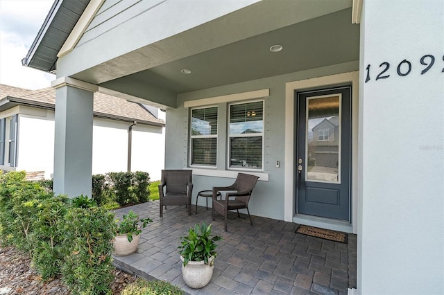 entrance to property featuring a porch