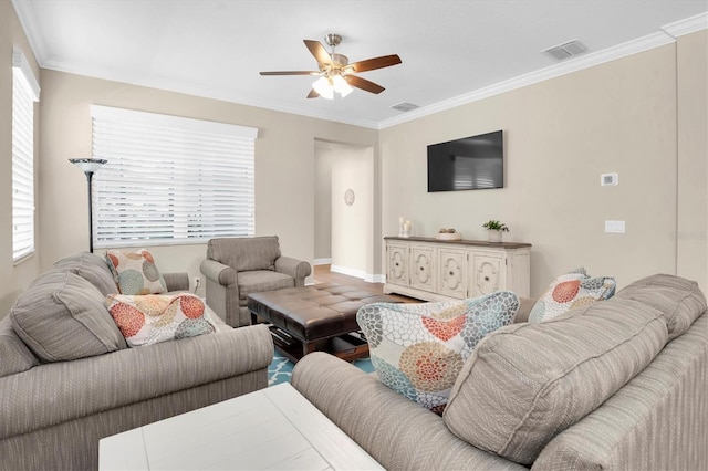 living room featuring ornamental molding and ceiling fan