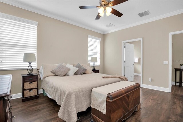 bedroom with ornamental molding, dark hardwood / wood-style floors, and ceiling fan