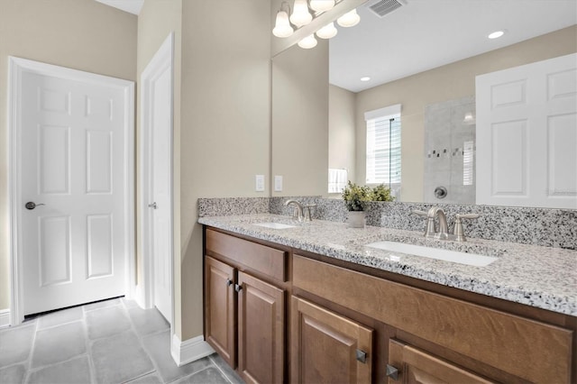 bathroom with vanity and a shower