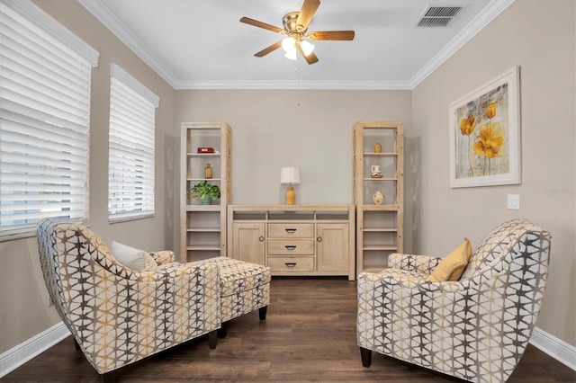 sitting room with ceiling fan, ornamental molding, and dark hardwood / wood-style floors