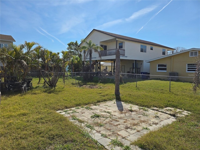 view of yard with a balcony