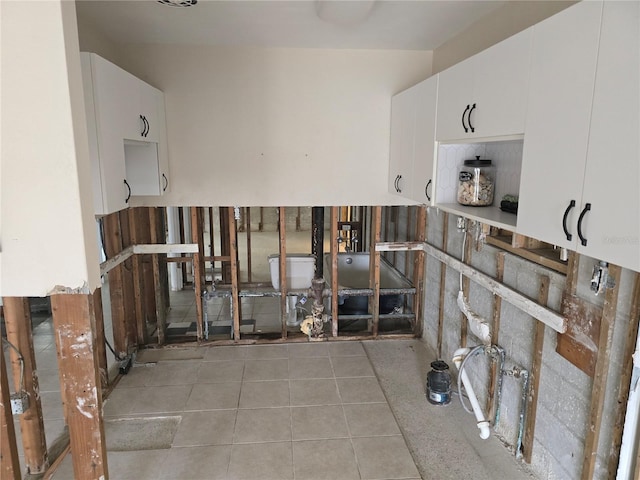 interior space featuring tile patterned floors and white cabinets