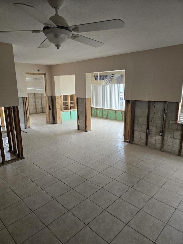 unfurnished room with ceiling fan