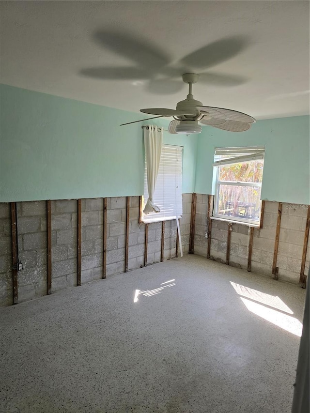 unfurnished room featuring ceiling fan