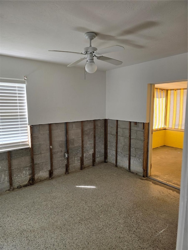 spare room with ceiling fan