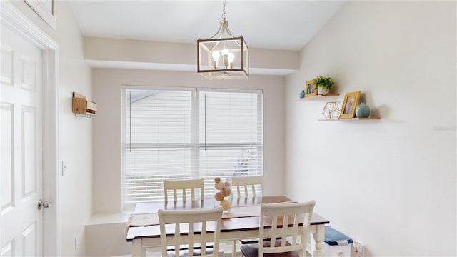 dining space with a notable chandelier