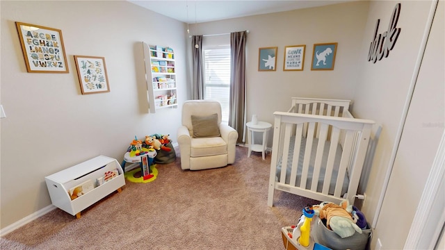 bedroom with carpet floors and a nursery area