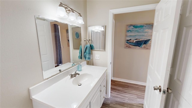 bathroom with vanity and wood-type flooring