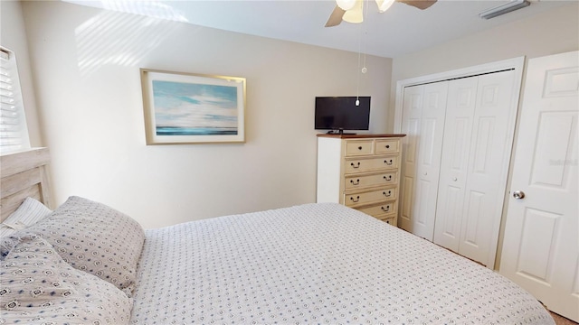 bedroom featuring ceiling fan and a closet