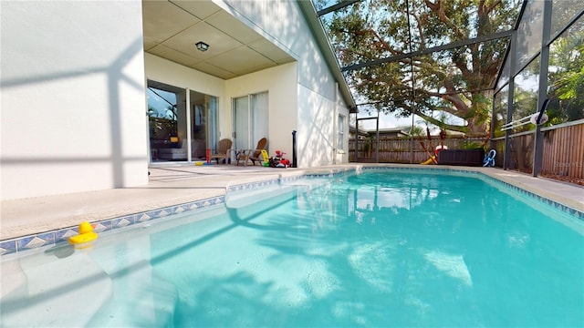 view of pool featuring a lanai and a patio area