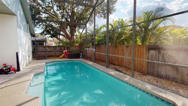 view of pool featuring a lanai