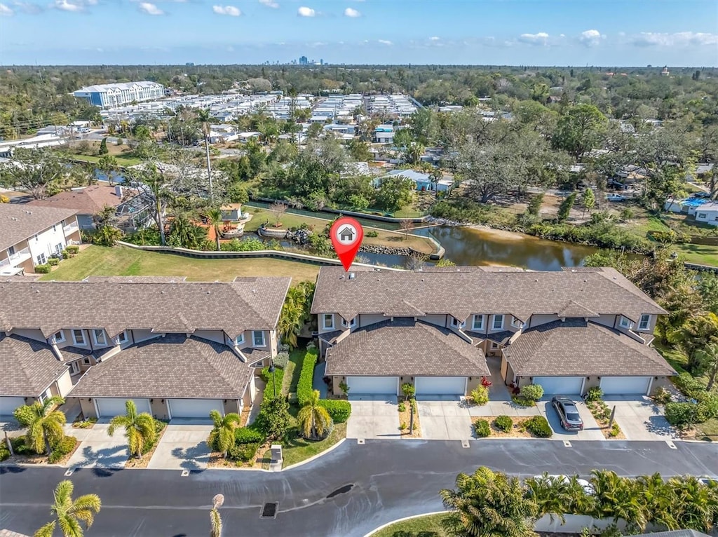 birds eye view of property with a water view