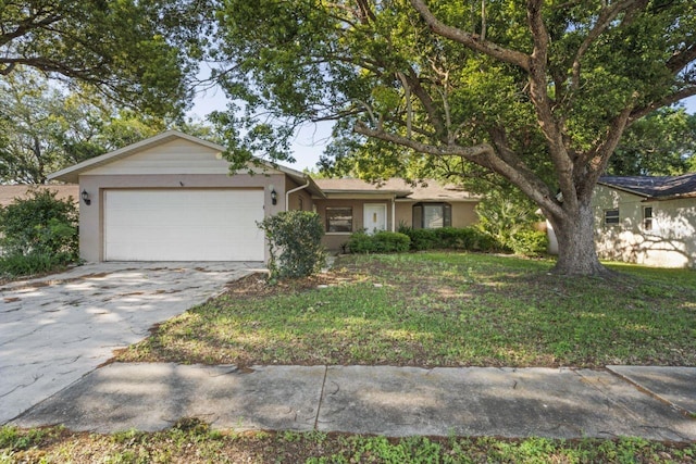 ranch-style house with a garage and a front lawn