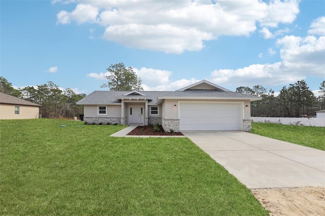 view of front facade with a garage and a front lawn