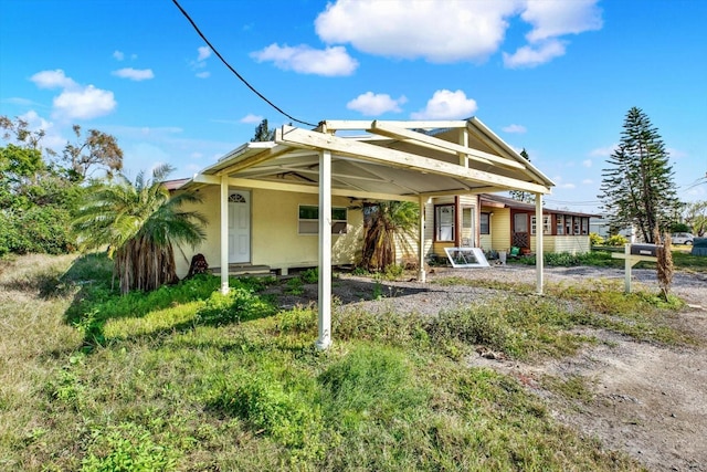 view of front of home featuring a carport