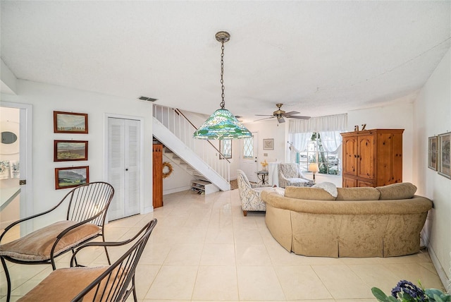 tiled living room with a textured ceiling