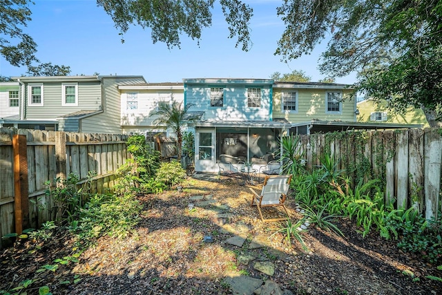 back of property featuring a sunroom