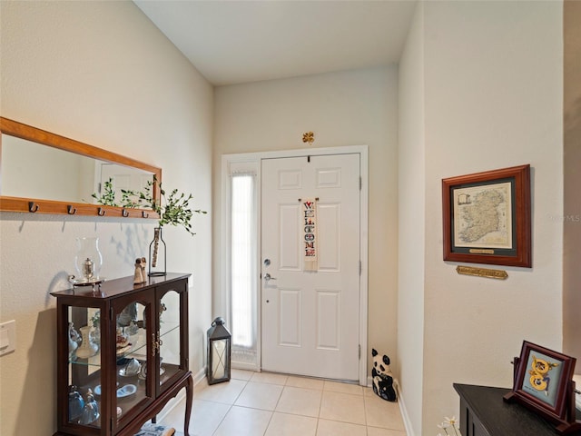 foyer with light tile patterned flooring