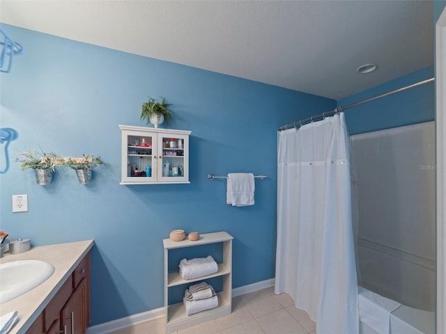 bathroom with tile patterned floors, a shower with shower curtain, and vanity