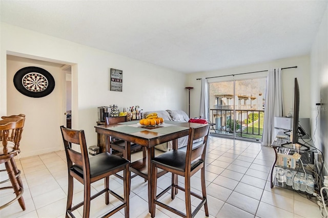 dining room featuring light tile patterned floors