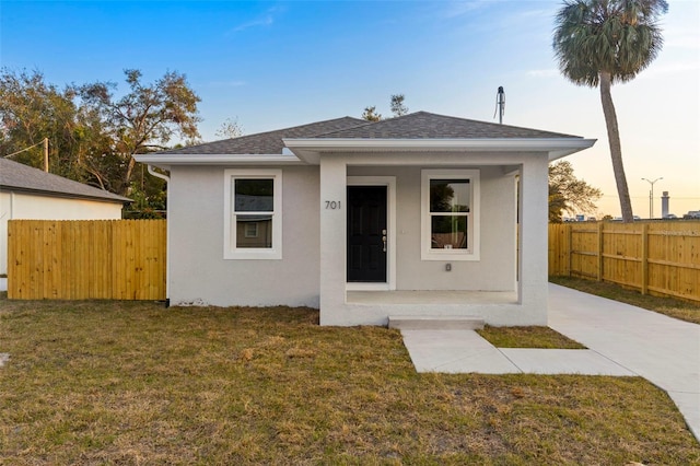 view of front of home with a lawn