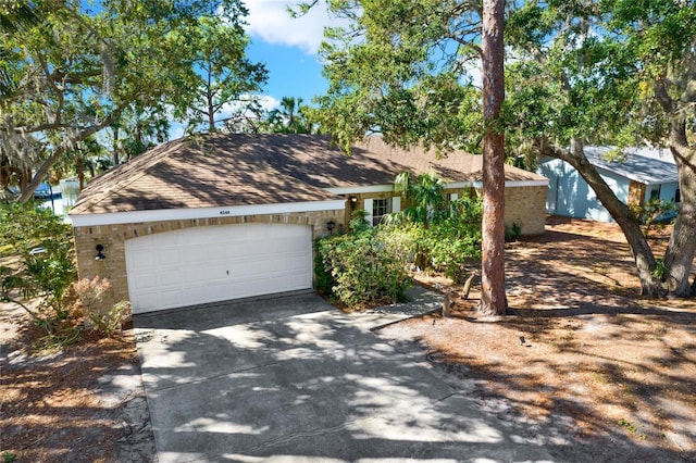 single story home with a garage