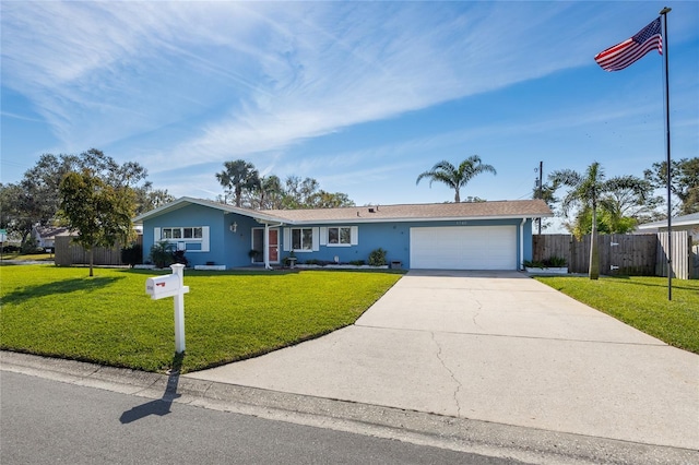 single story home featuring a garage and a front yard