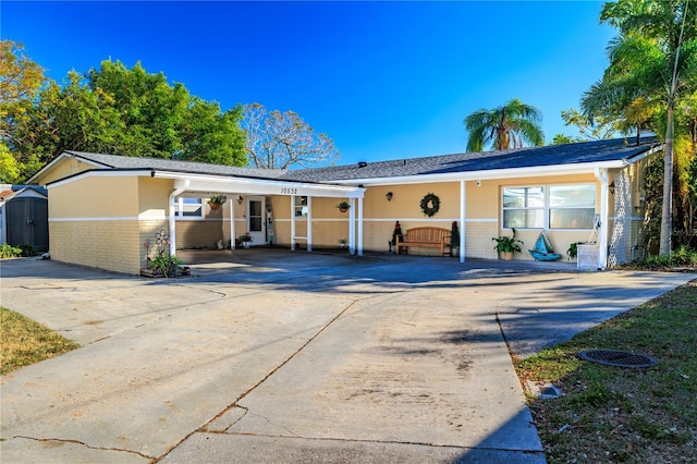 ranch-style house with a carport