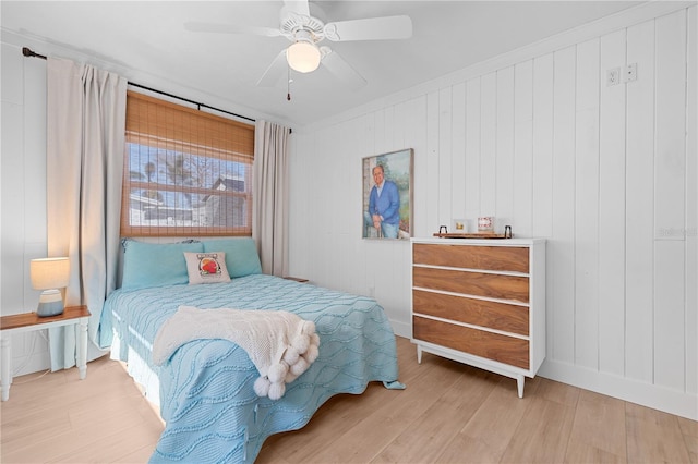 bedroom with ceiling fan and light hardwood / wood-style flooring