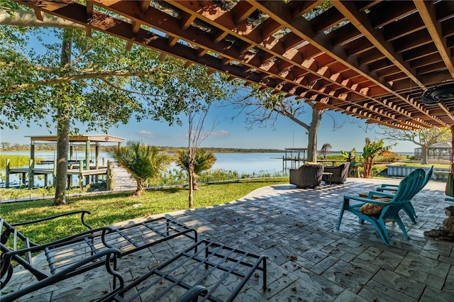 view of patio / terrace featuring a water view and a pergola