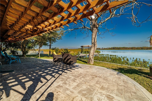 view of patio featuring a water view and a pergola