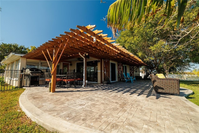 view of patio / terrace featuring grilling area and a pergola