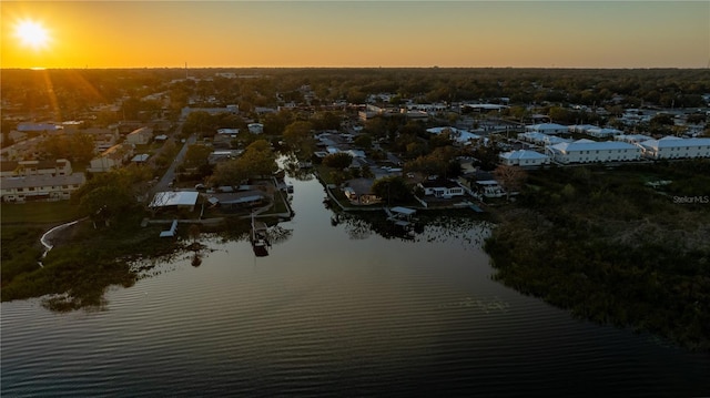 aerial view at dusk with a water view