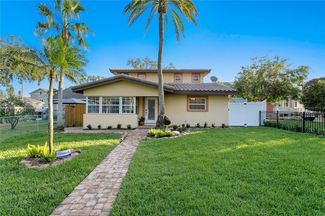 view of front of home with a front lawn