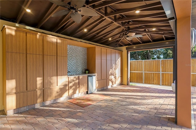 exterior space featuring vaulted ceiling and ceiling fan