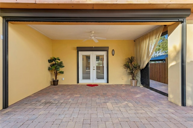 property entrance with a patio area, french doors, and ceiling fan