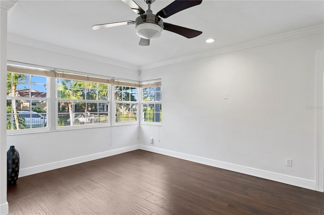 unfurnished room with crown molding, dark hardwood / wood-style floors, and ceiling fan