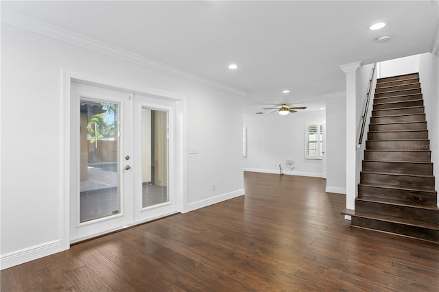 unfurnished living room featuring crown molding, dark wood-type flooring, french doors, and ceiling fan