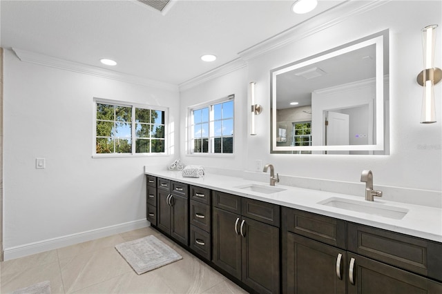 bathroom featuring ornamental molding, vanity, and tile patterned floors