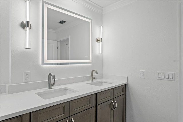 bathroom with ornamental molding and vanity