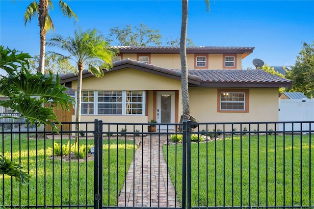 mediterranean / spanish-style house with a front yard