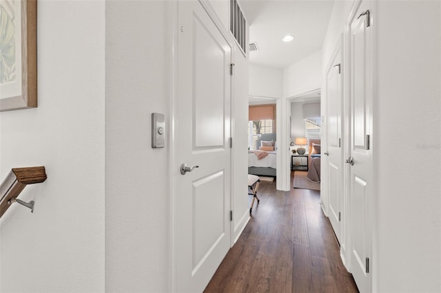 corridor with dark wood-type flooring