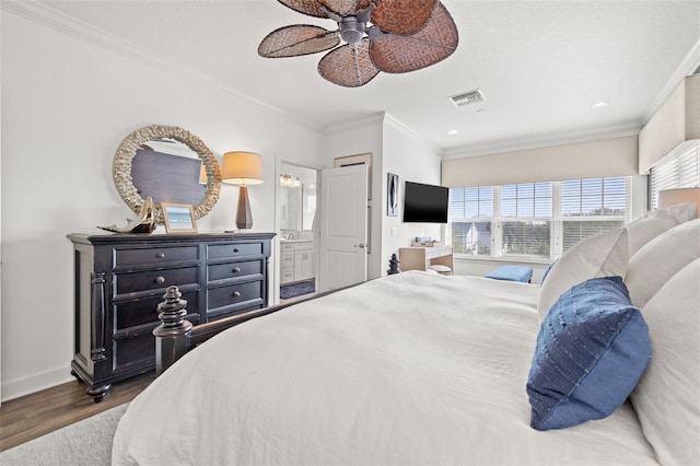 bedroom featuring crown molding, dark wood-type flooring, ceiling fan, and ensuite bathroom