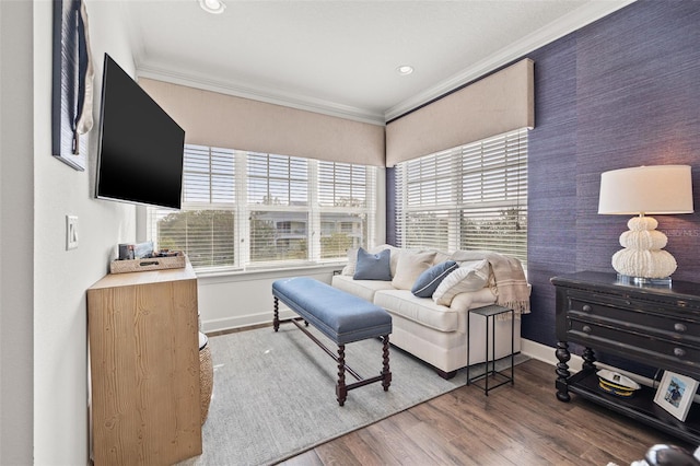 living room featuring crown molding, hardwood / wood-style flooring, and a wealth of natural light